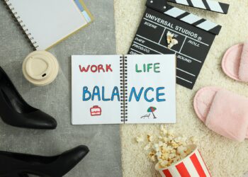 Concept of work-life balance, writing in notebook.