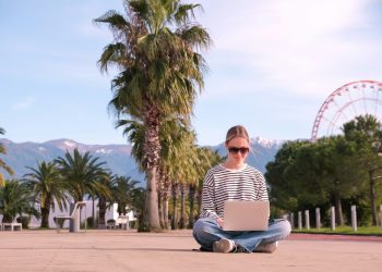 Remote work.business travel,freelancer works remotely sea shore.workation, remote work,leisure, work