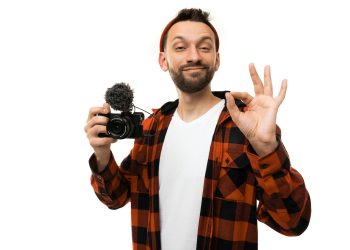videographer blogger leads the stream and shows with a gesture OK