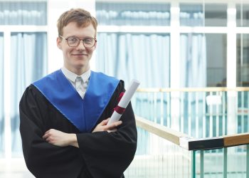 Young man holding diploma