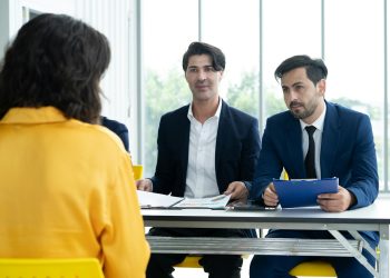 Job interview. Diverse hr team doing job interview with a woman in business office. Human resources