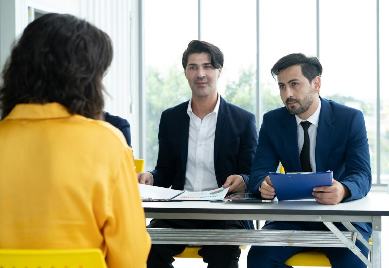 Job interview. Diverse hr team doing job interview with a woman in business office. Human resources