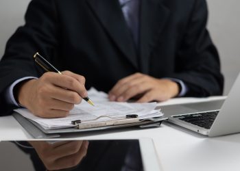 businessman hold pen signing or signature contract law