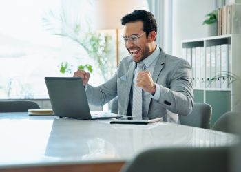 Man, laptop and celebrate office success or victory, promotion email and salary increase news. Male