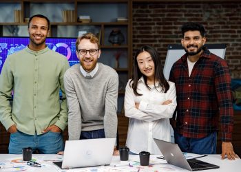 A team of young multinational business people are working on a startup. New generation of startups