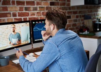 Adult man is taking an online management course