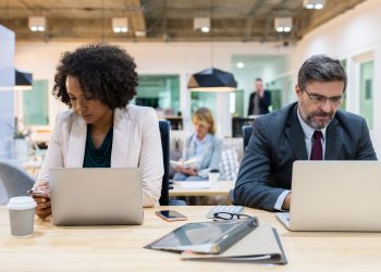Business people working on digital devices