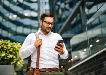 Businessman using his phone.