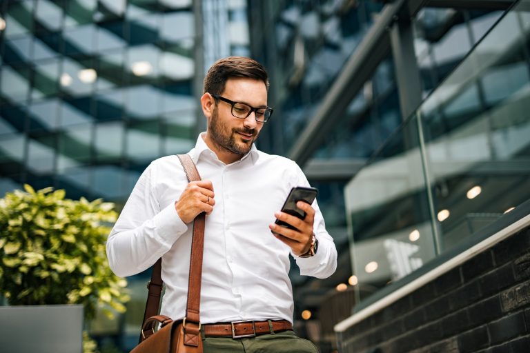 Businessman using his phone.