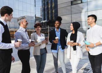 Diverse Business Professionals Networking Outdoors with Coffee