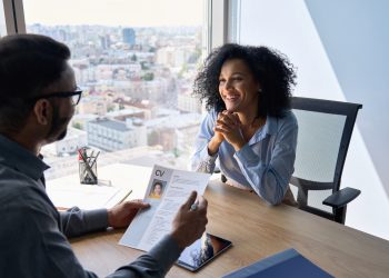 Friendly interview between indian hr manager and African American applicant.