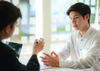 Interviewing job seekers presenting their resume for executives to consider.