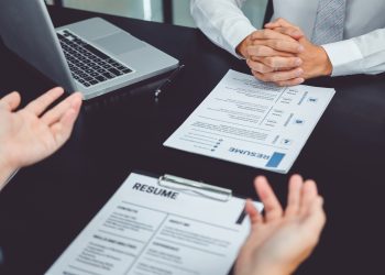 Job interview concept , Senior manager reading a resume