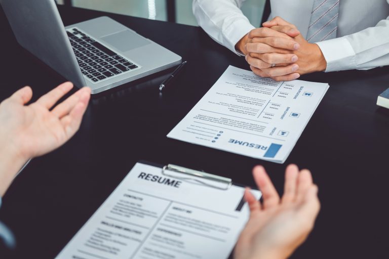 Job interview concept , Senior manager reading a resume