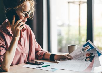 Manager looking at many different cv resume and choosing perfect person.