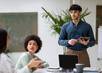 Middle Eastern Businessman Presents Startup Strategy to Team At Office
