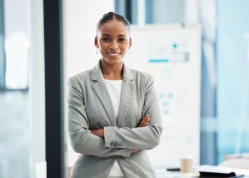 Professional, corporate businesswoman with arms crossed, in position of leadership, in marketing st