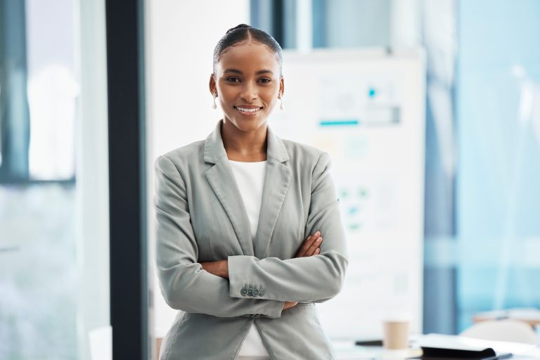 Professional, corporate businesswoman with arms crossed, in position of leadership, in marketing st