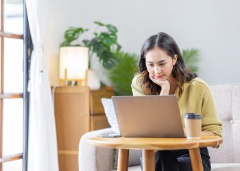 Recruitment Concept. Indian Asian Girl Browsing Work Opportunities Online, Using Job Search App or