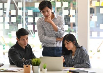 Startup concept, Team of young business analysis data in laptop computer.