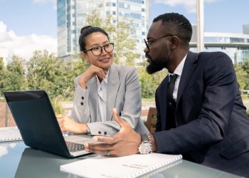 Two business partners discussing new strategies and ideas