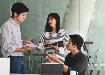 Young business meeting with startup project in modern office.