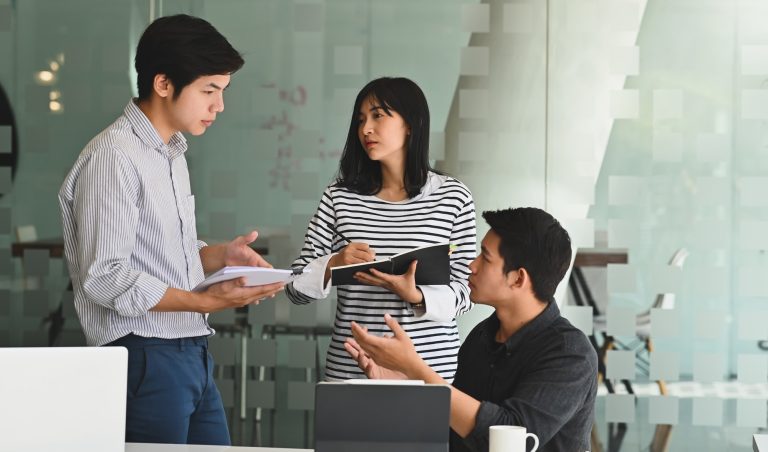 Young business meeting with startup project in modern office.