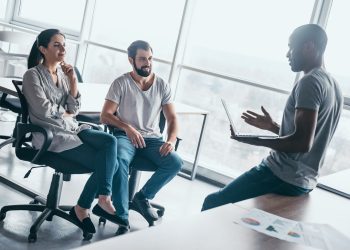 Young professional team discussing business plan in the office