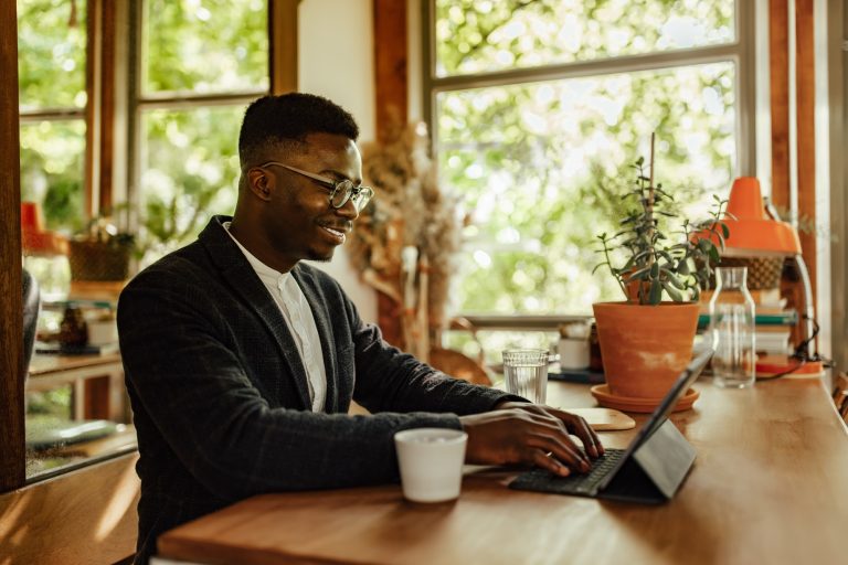 Adult man, making sure his resume is well written.