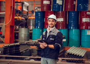 Efficient Industrial Operations: Factory Worker and Engineering Manager at Industrial Worksite