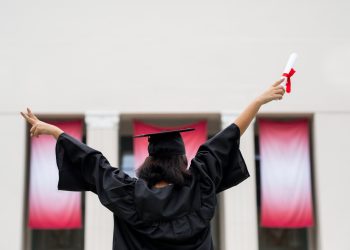 Graduating student celebrating academic achievement