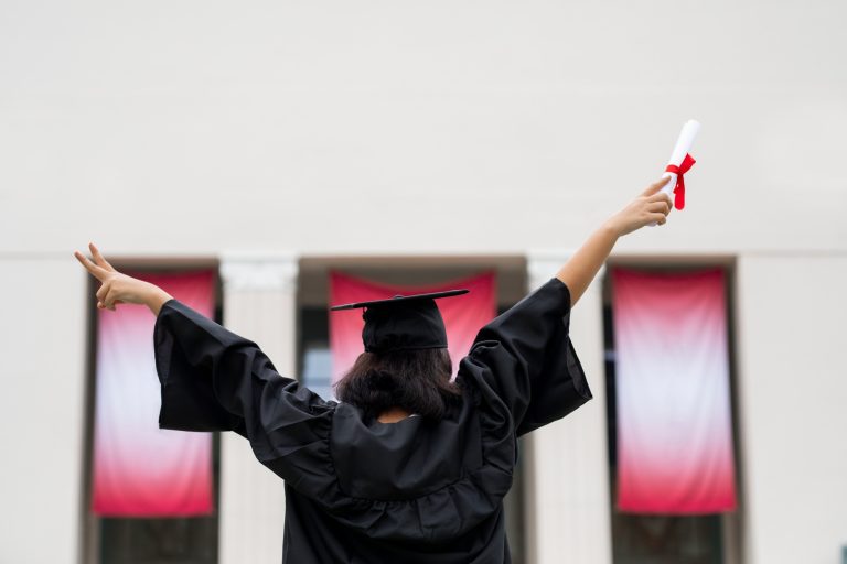 Graduating student celebrating academic achievement