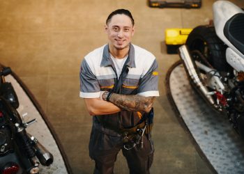 Happy Tattooed Motorcycle Mechanic