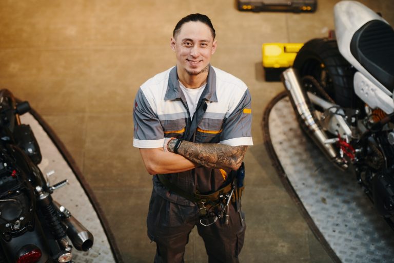 Happy Tattooed Motorcycle Mechanic