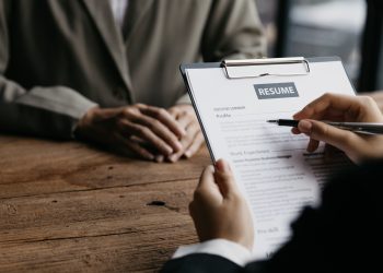 Person submitting resume to interview for a job with a company.