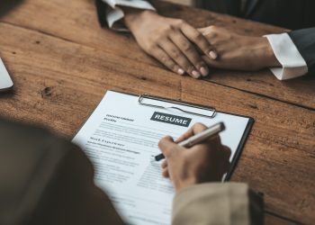 Person submitting resume to interview for a job with a company.